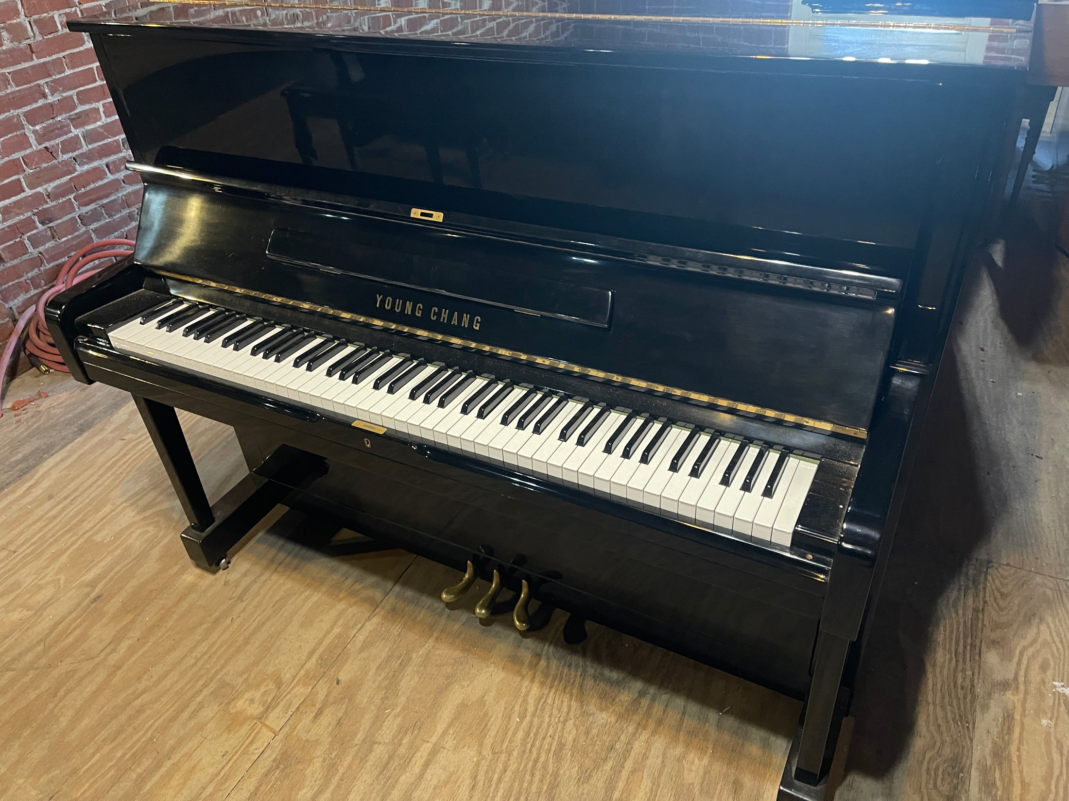 Young Chang Professional Studio piano in polished ebony